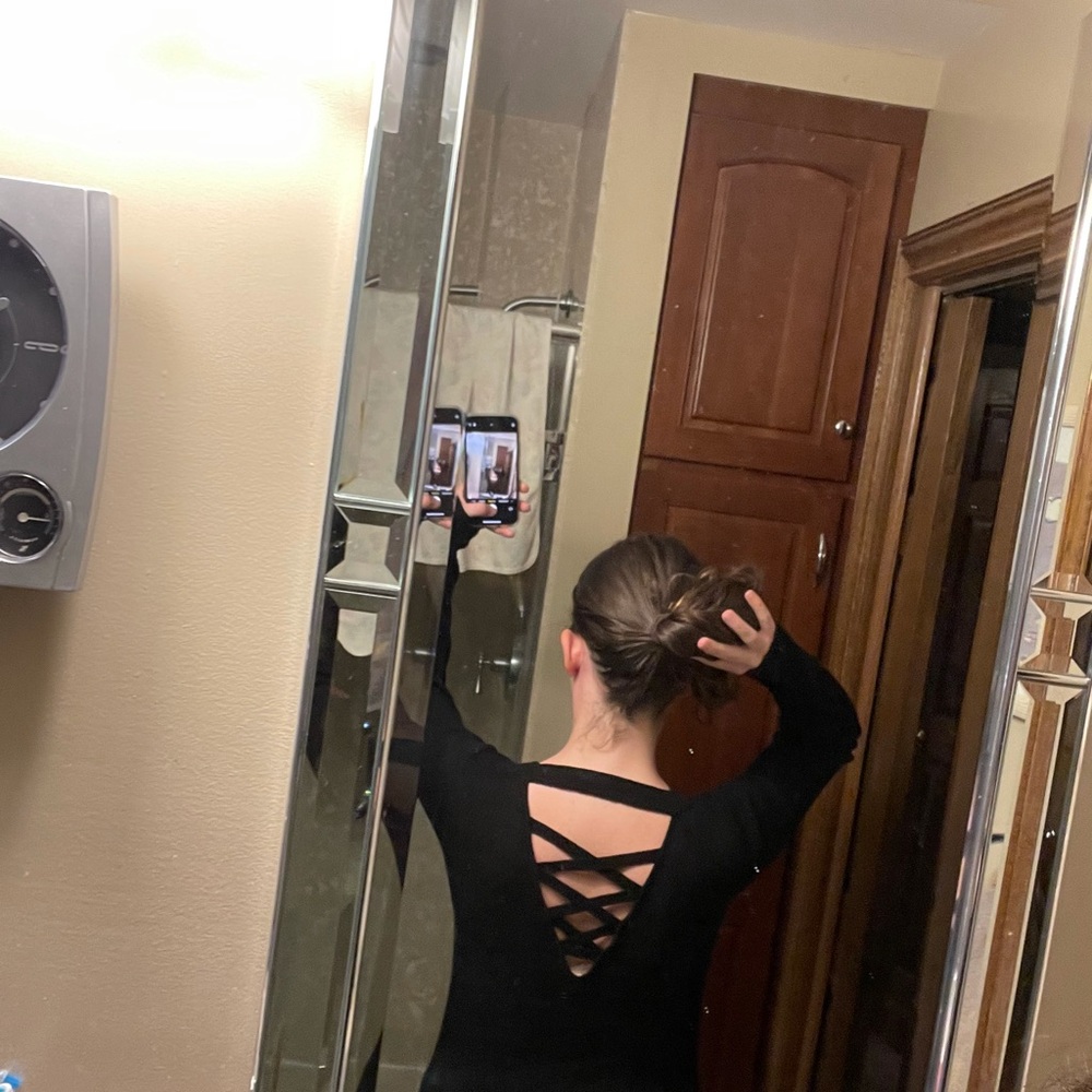 Open back/strappy black sweater women’s size S